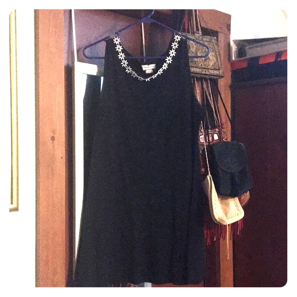 little black dress with daisies around the neck